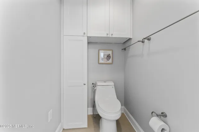 a kitchen with white cabinets stainless steel appliances and sink