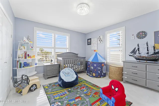 a bathroom with a sink vanity mirror and toilet