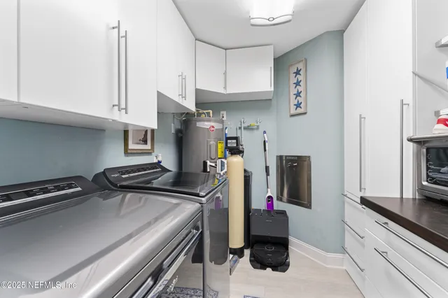 a spacious bedroom with a bed and a large window