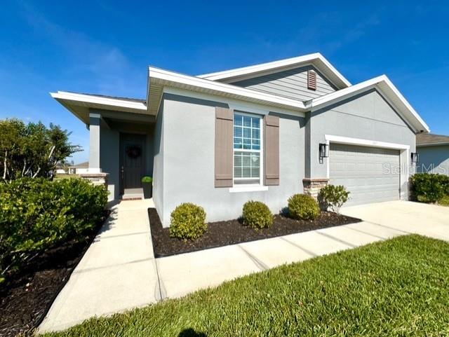 1807 Partin Terrace Road Kissimmee, FL 34744 - Photo 1 of 1 a front view of a house with a yard