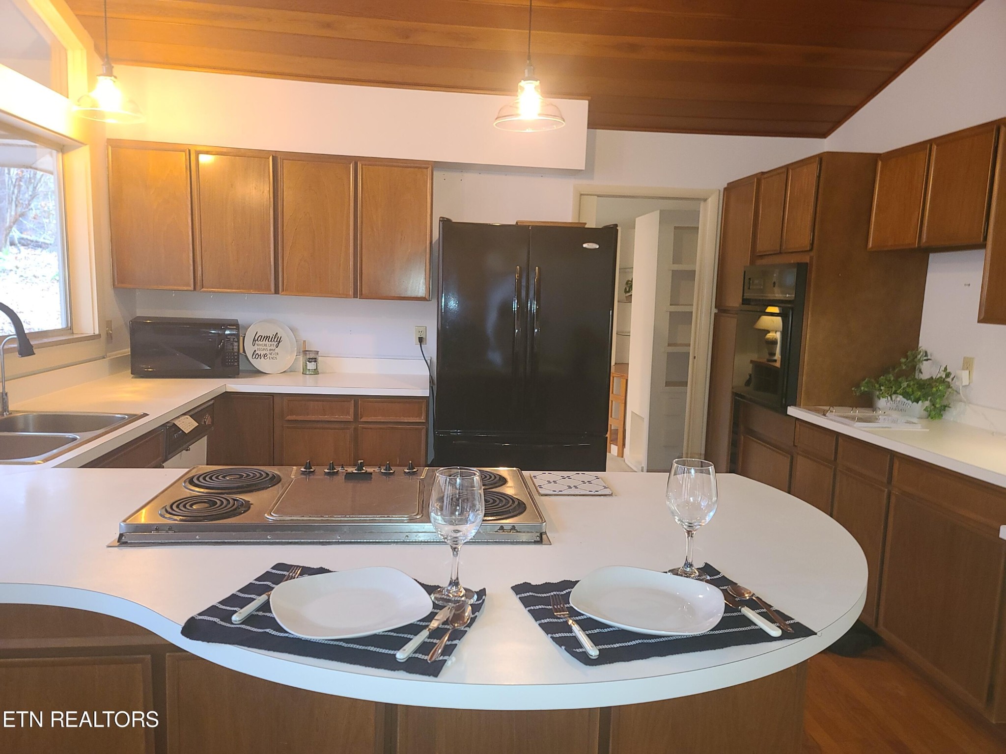104 Mohawk Road Oak Ridge, TN 37830 - Photo 54 of 58 a kitchen with a sink and refrigerator