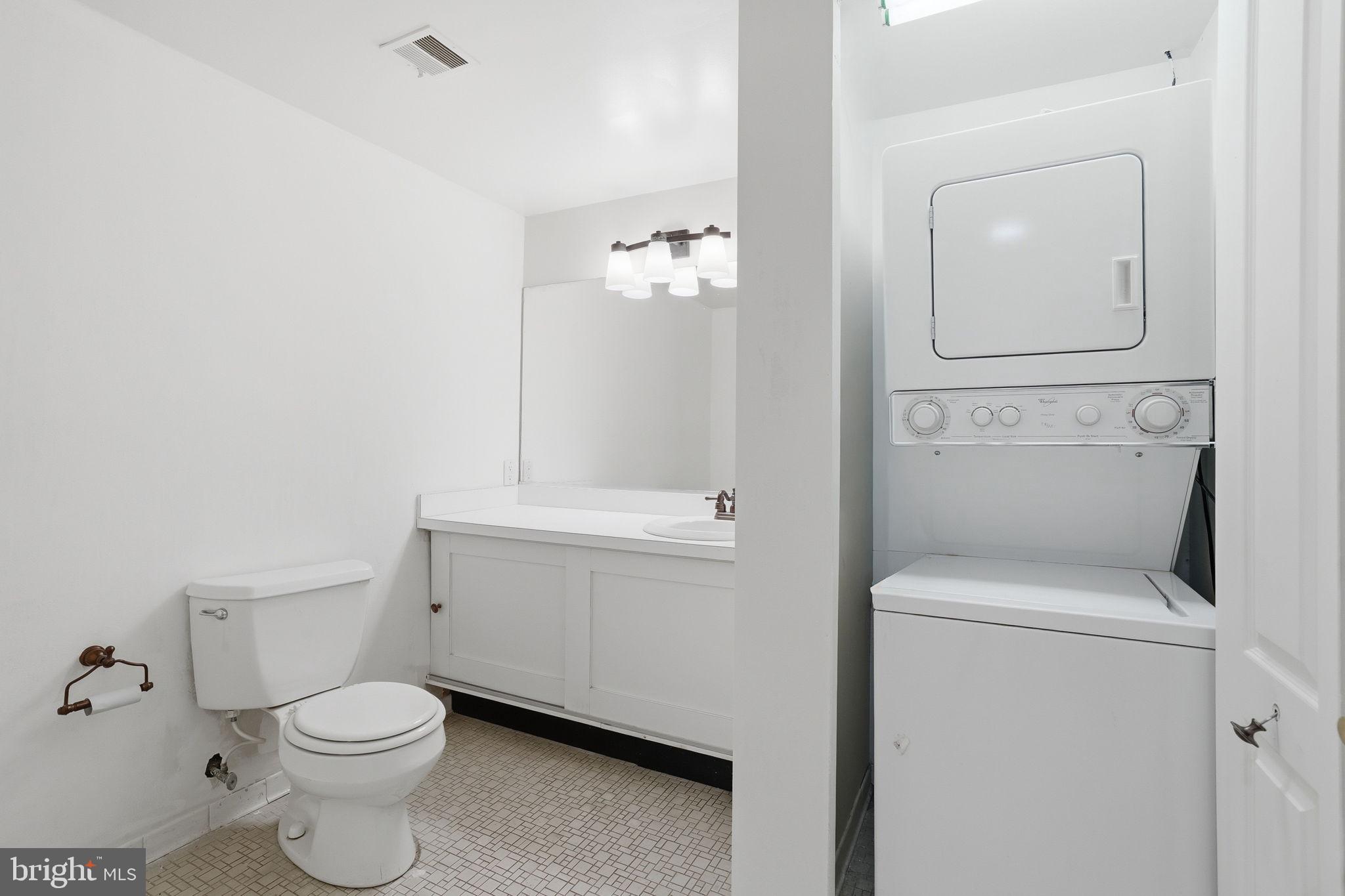 7 Slade Avenue, Unit 717 Baltimore, MD 21208 - Photo 17 of 31 Second bathroom with washer and dryer.