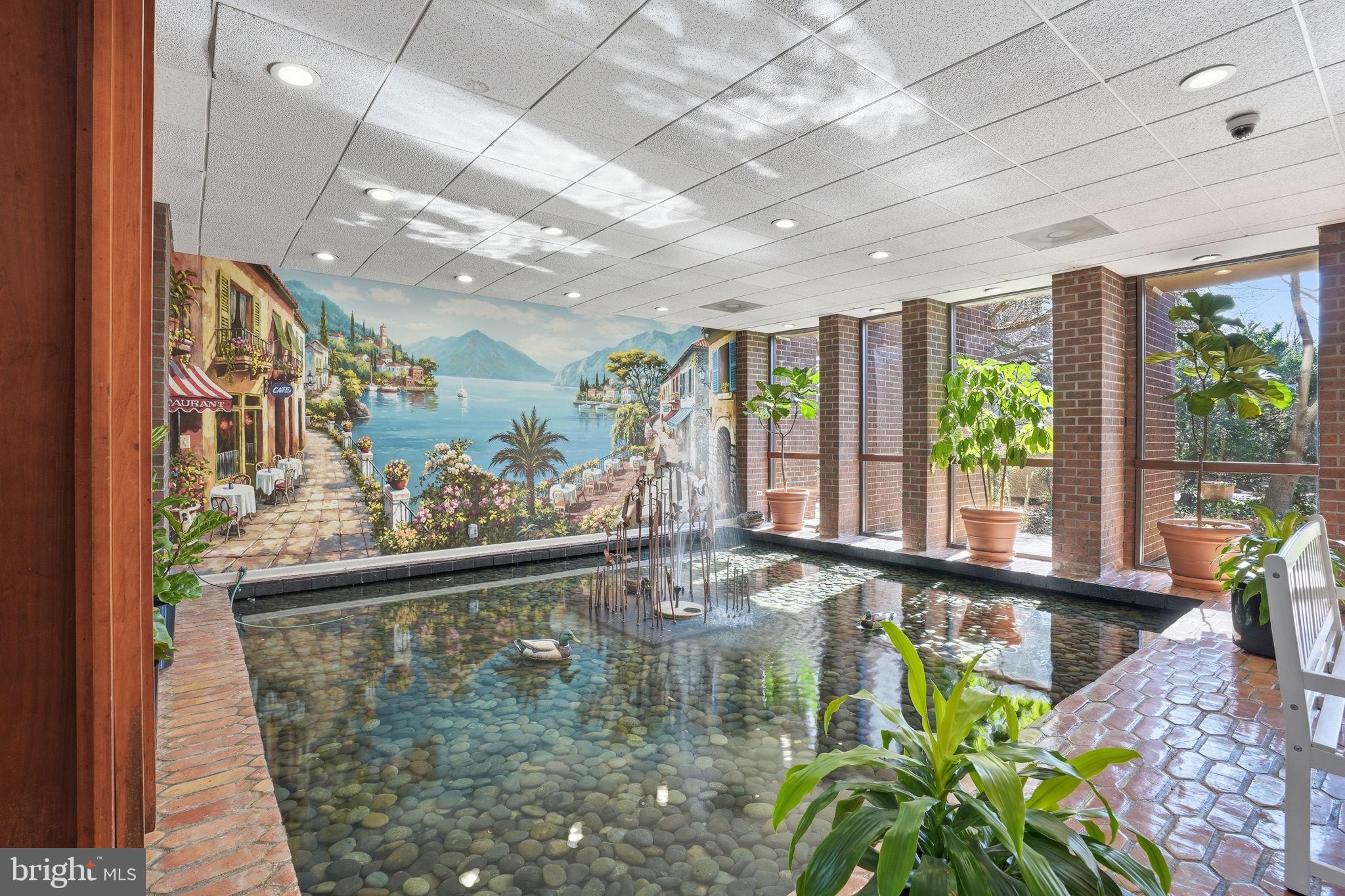 7 Slade Avenue, Unit 717 Baltimore, MD 21208 - Photo 24 of 31 Lobby water feature.