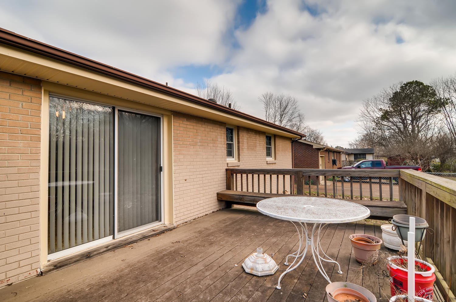 456 Rural Hill Road Nashville, TN 37217 - Photo 22 of 28 a view of a patio with a table chairs and a barbeque