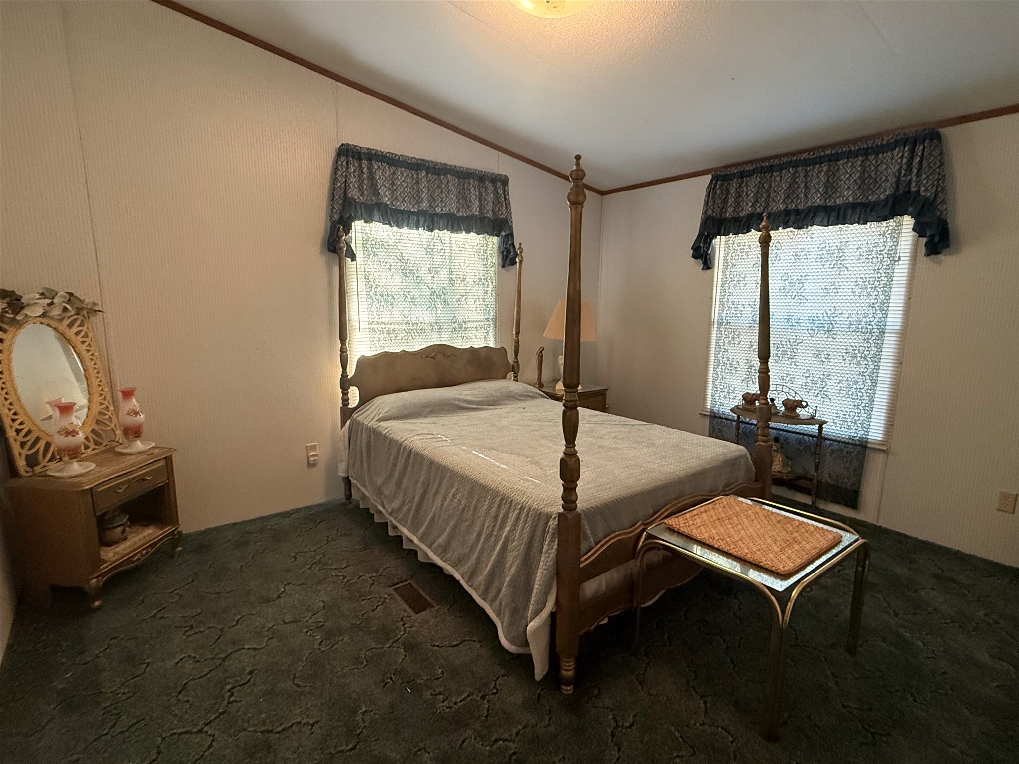 305 Canadian Drive Trinity, TX 75862 - Photo 22 of 29 a bed sitting in a room next to a window