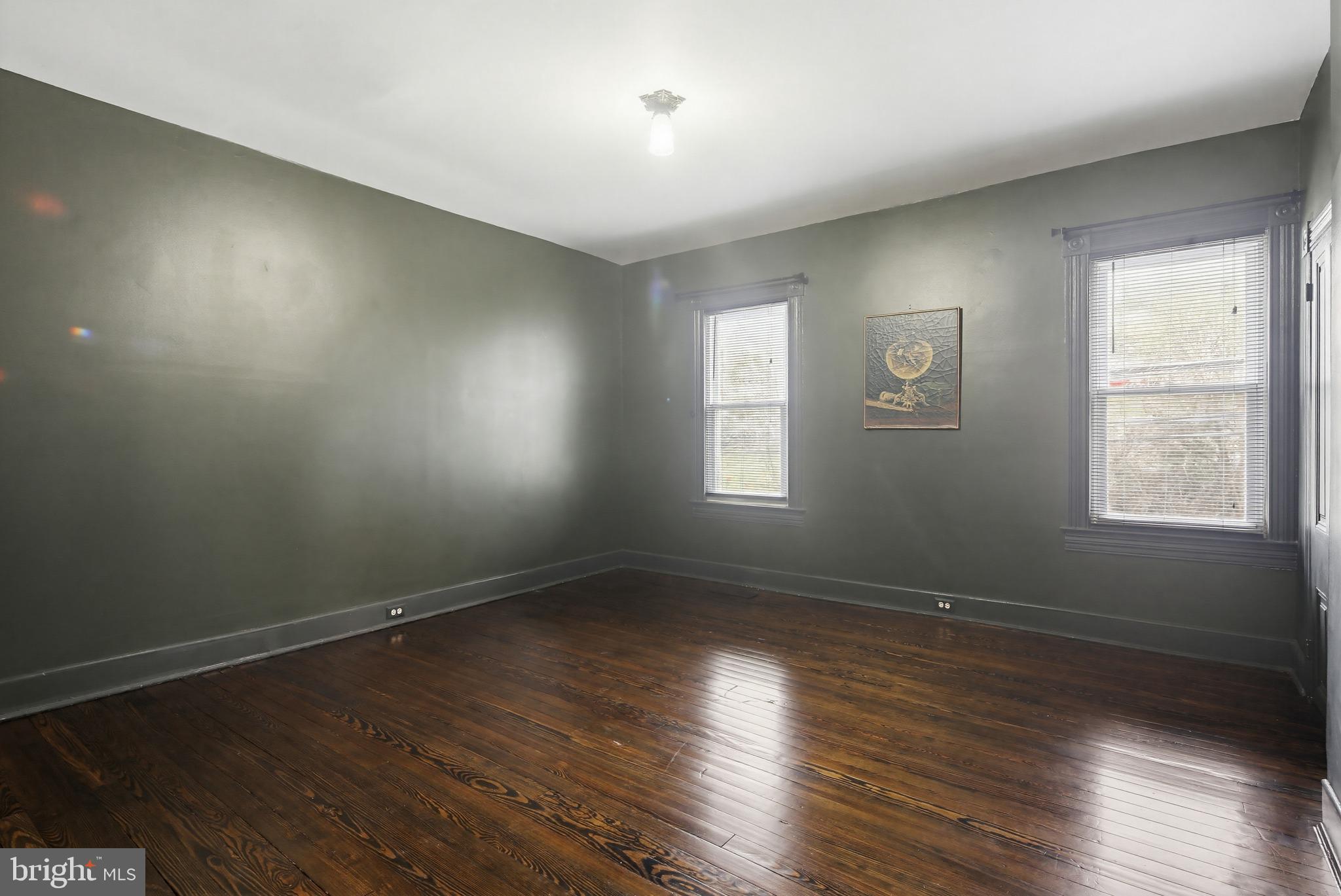 8556 Frederick Road Ellicott City, MD 21043 - Photo 18 of 38 an empty room with wooden floor and windows