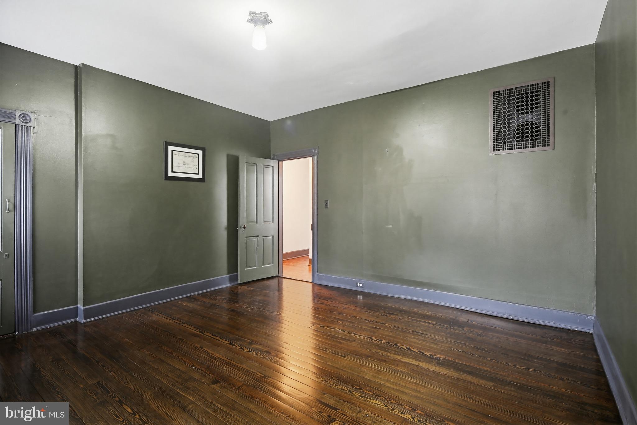 8556 Frederick Road Ellicott City, MD 21043 - Photo 19 of 38 a view of an empty room with wooden floor