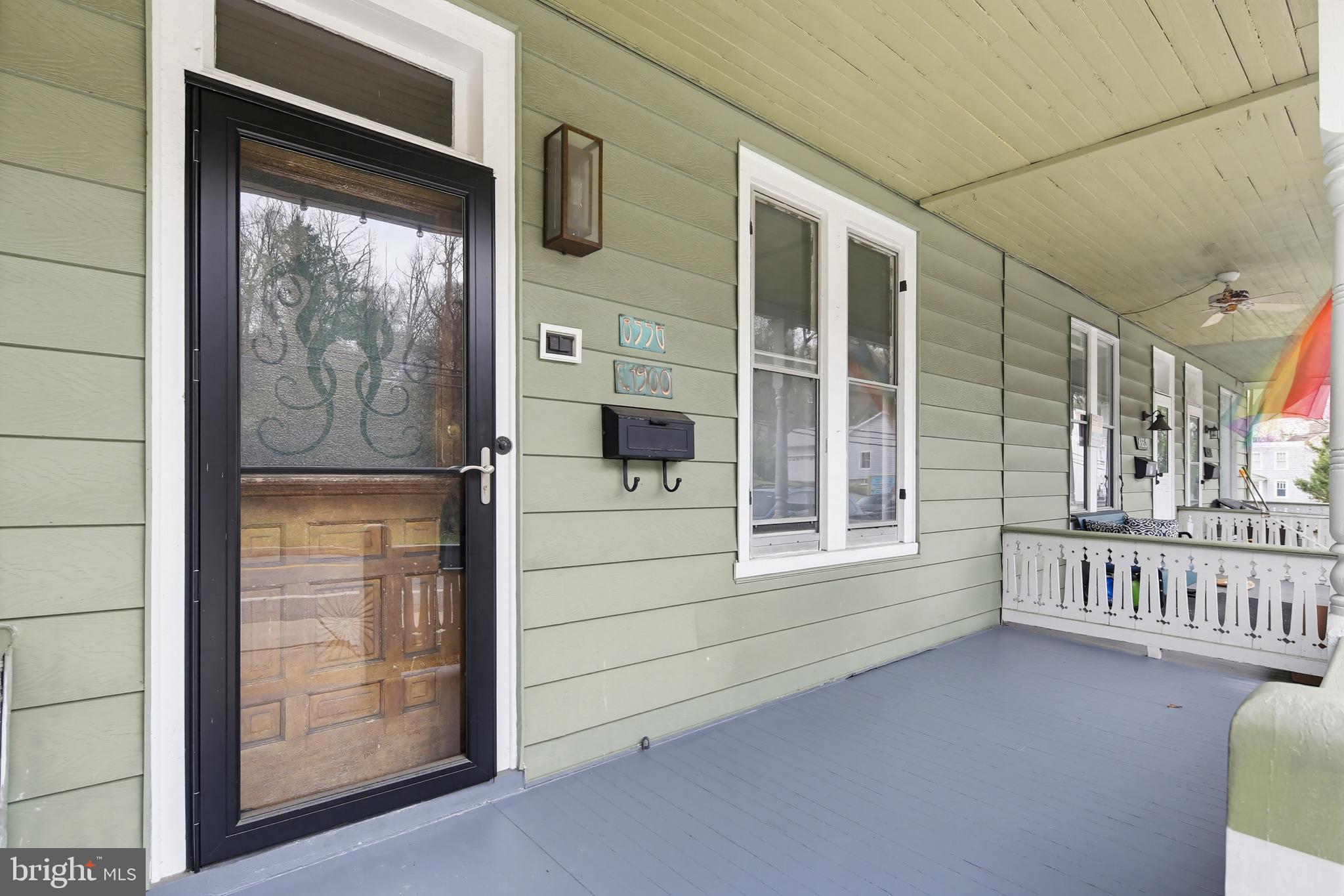 8556 Frederick Road Ellicott City, MD 21043 - Photo 2 of 38 a view of front door and porch with wooden floor