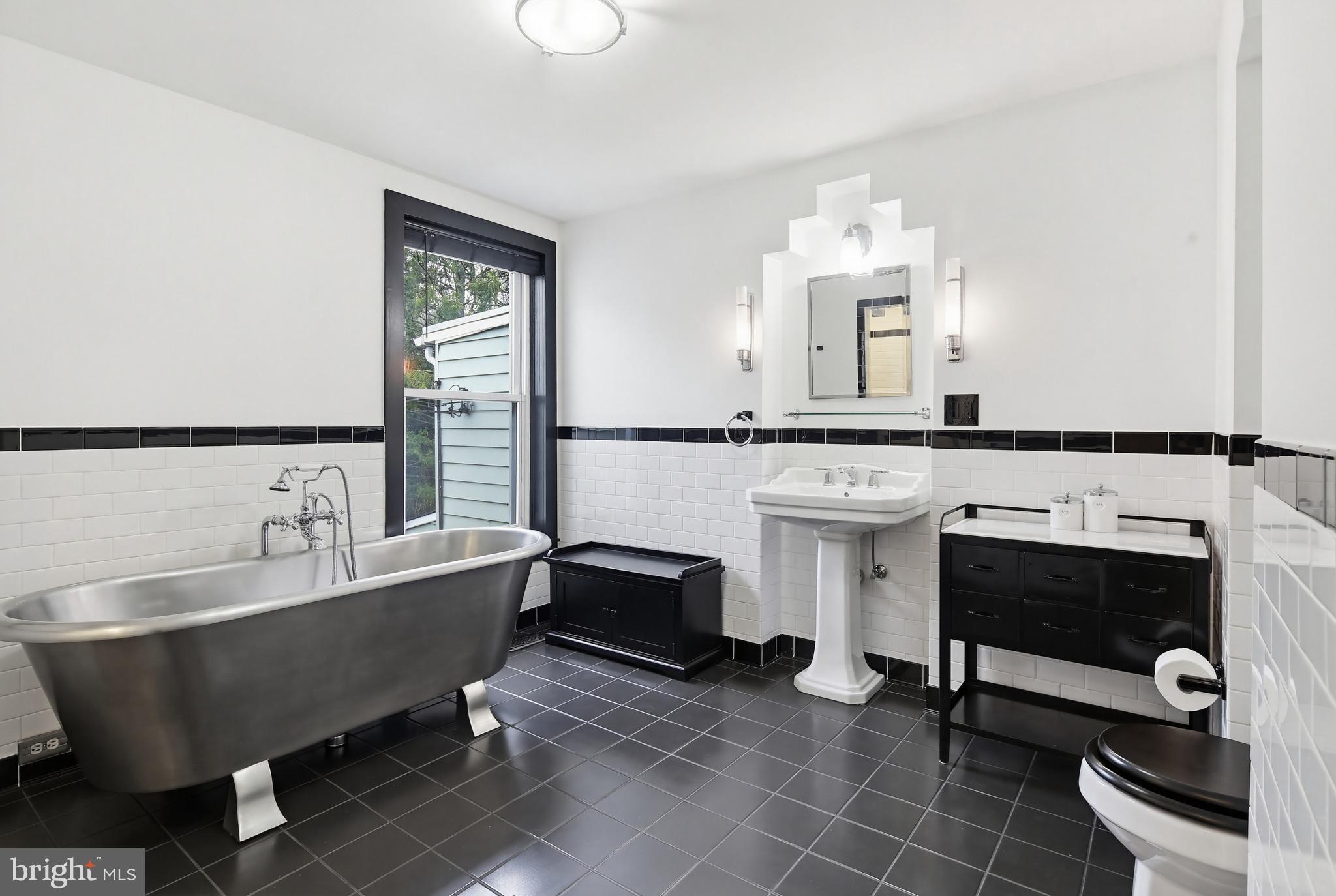 8556 Frederick Road Ellicott City, MD 21043 - Photo 25 of 38 a living room with furniture a rug and a fireplace