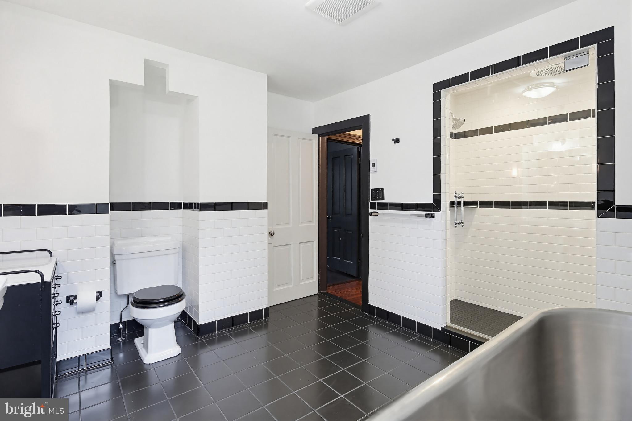 8556 Frederick Road Ellicott City, MD 21043 - Photo 26 of 38 a view of a walk in closet