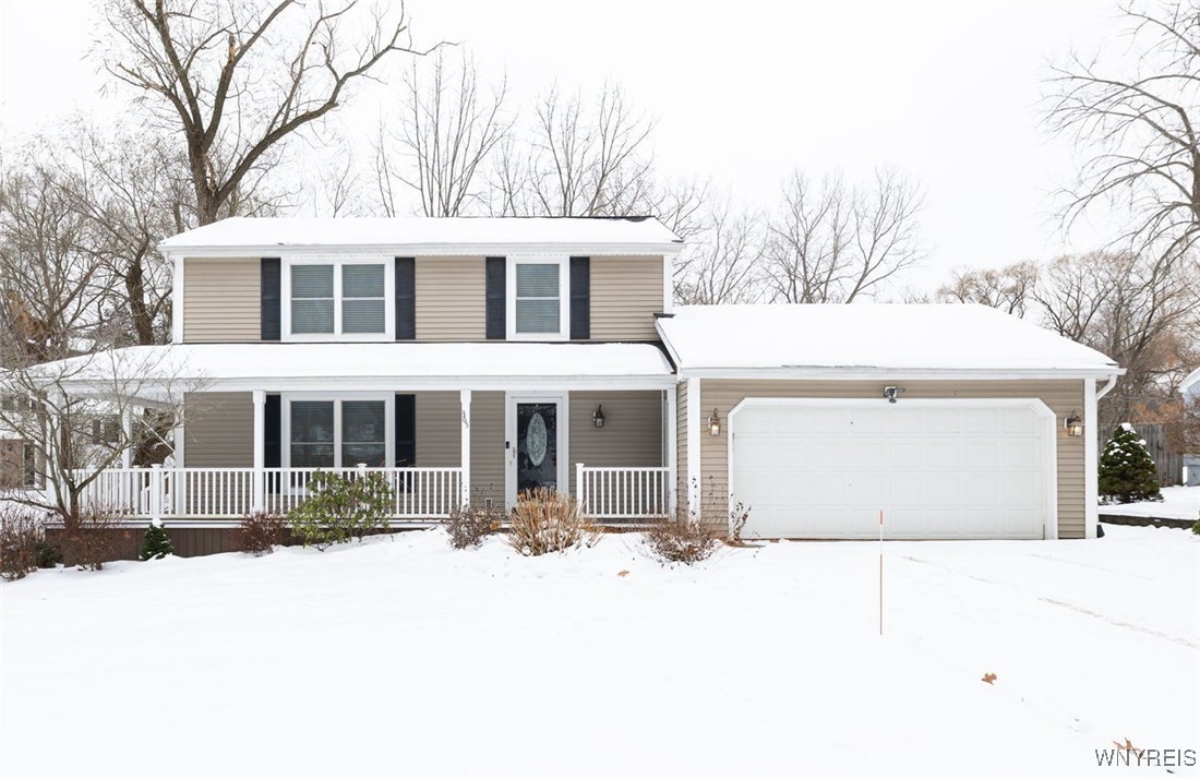 The wrap around porch welcomes guests to 365 Belme