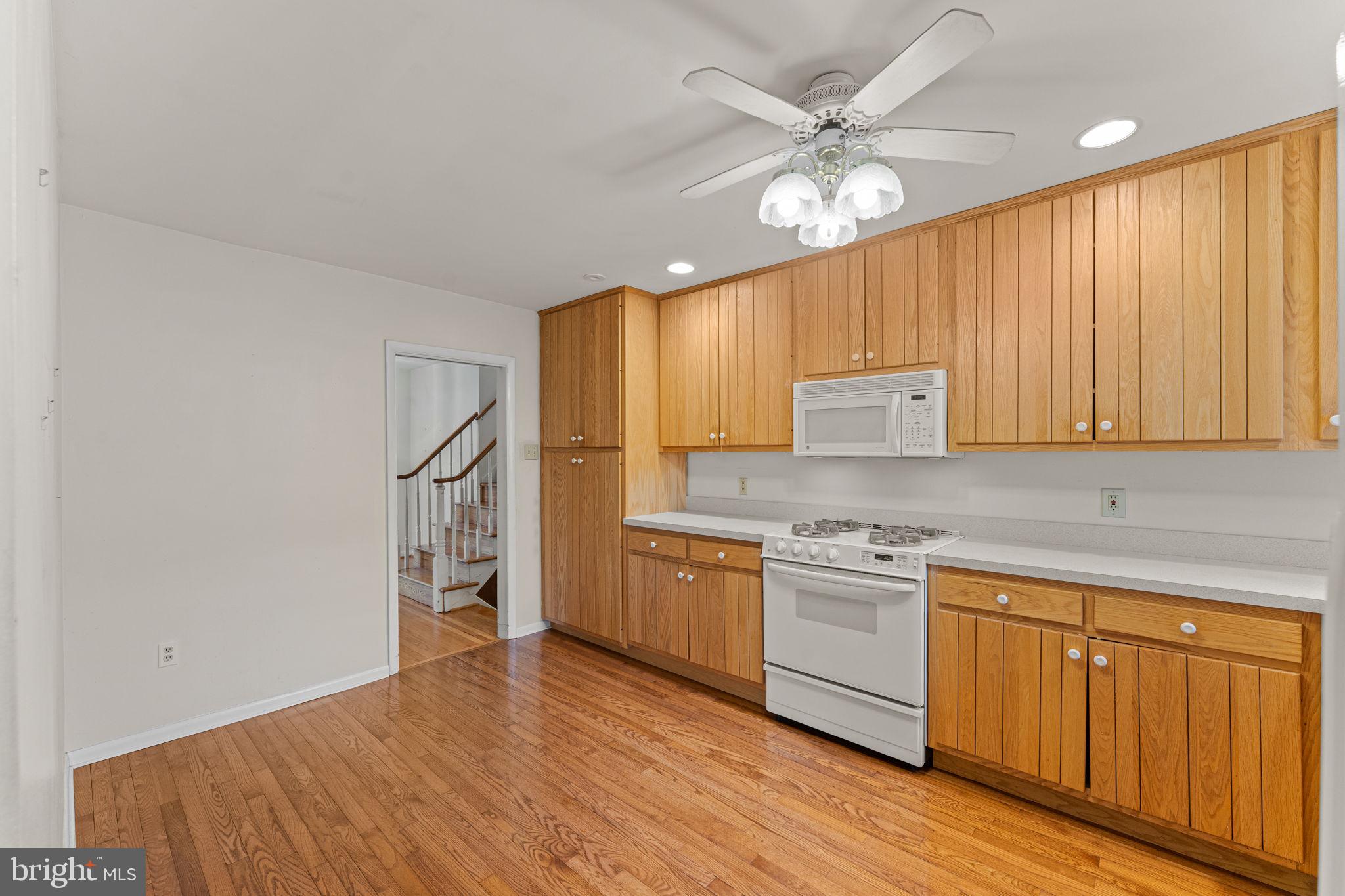 1022 Crozer Lane Springfield, PA 19064 - Photo 13 of 42 a kitchen with a stove a sink and a refrigerator