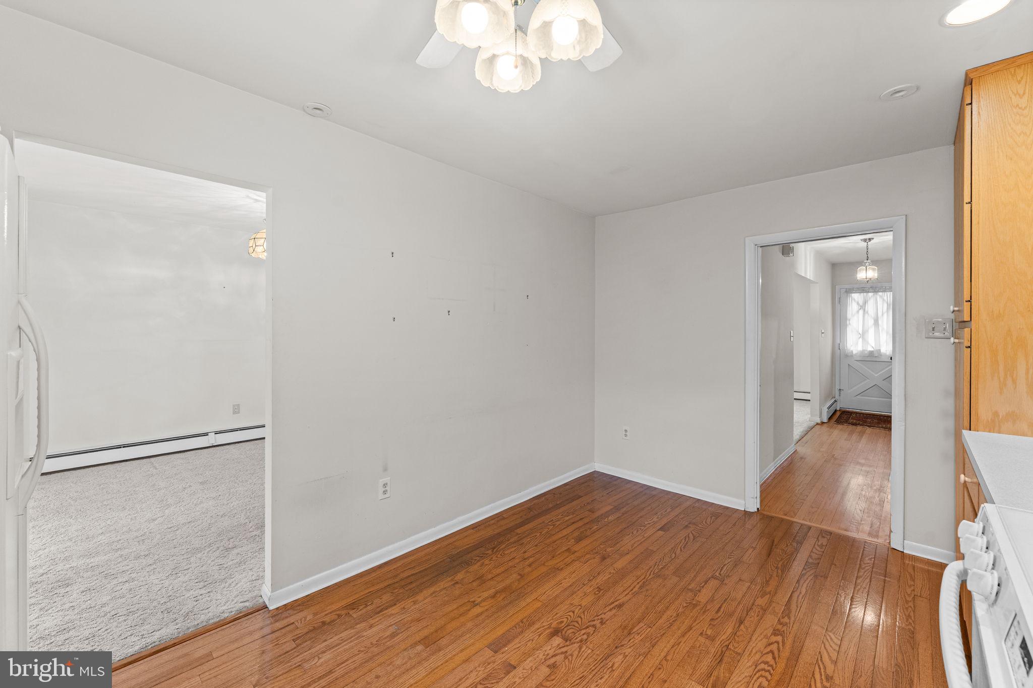 1022 Crozer Lane Springfield, PA 19064 - Photo 14 of 42 a view of a room with wooden floor and a ceiling fan