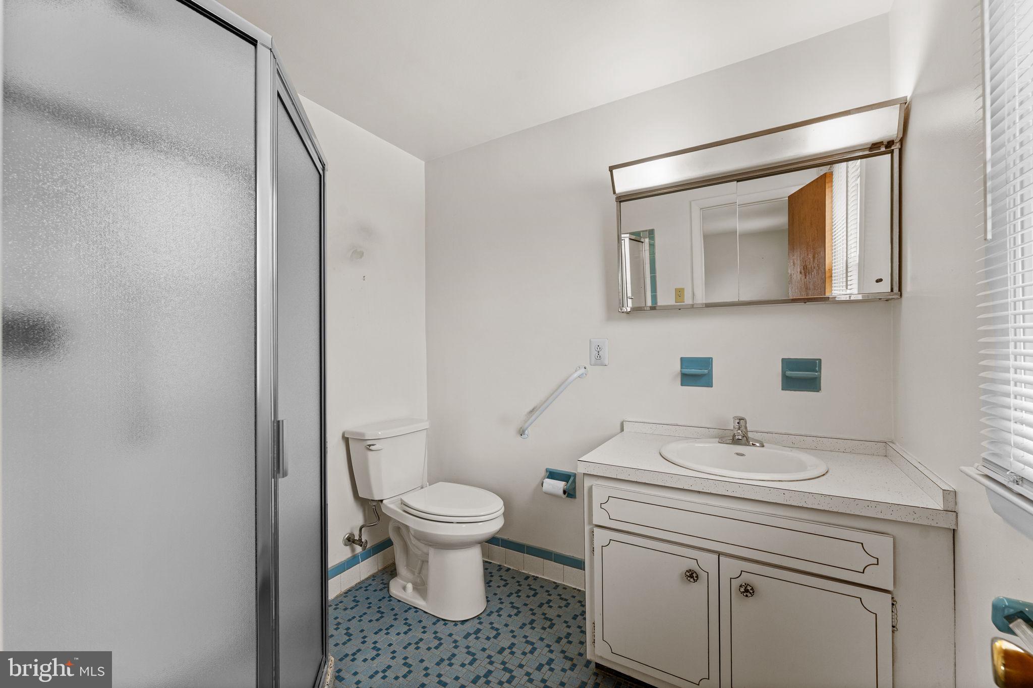 1022 Crozer Lane Springfield, PA 19064 - Photo 17 of 42 a bathroom with a sink toilet and mirror