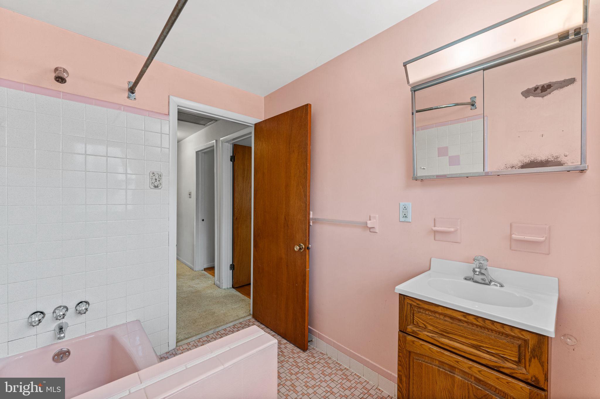1022 Crozer Lane Springfield, PA 19064 - Photo 23 of 42 a bathroom with a tub sink and mirror