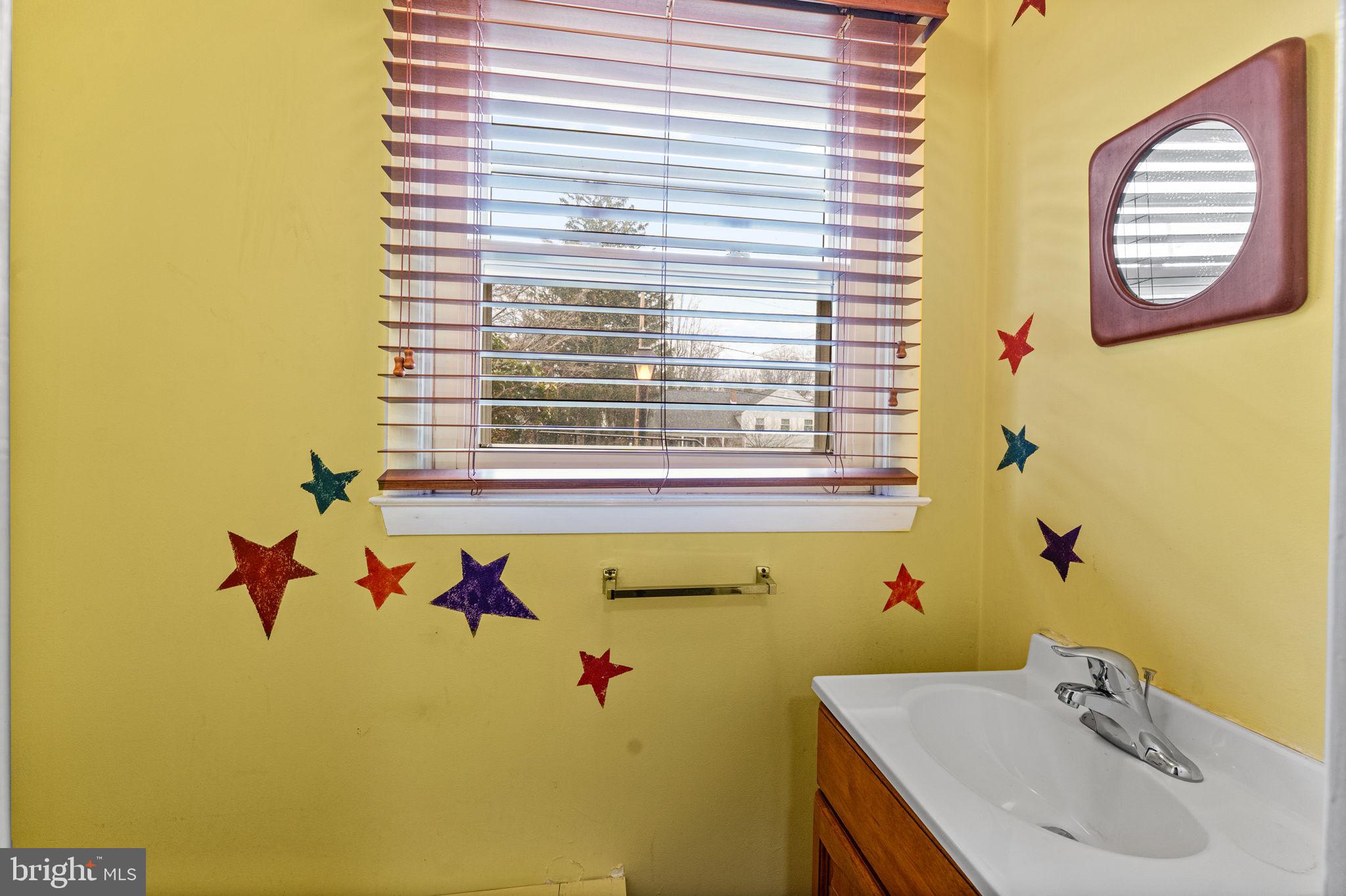 1022 Crozer Lane Springfield, PA 19064 - Photo 29 of 42 a bathroom with a sink and a window