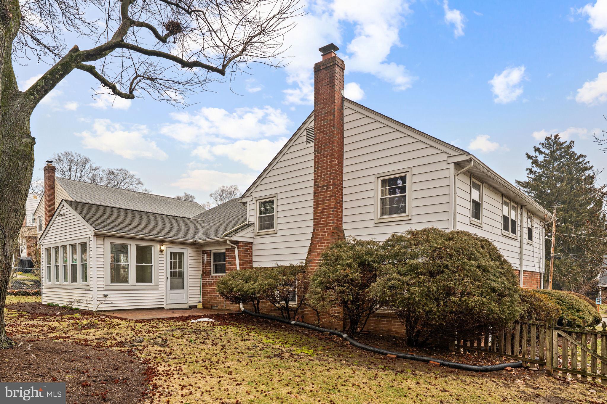 1022 Crozer Lane Springfield, PA 19064 - Photo 32 of 42 a view of a house with a snow on the side of it