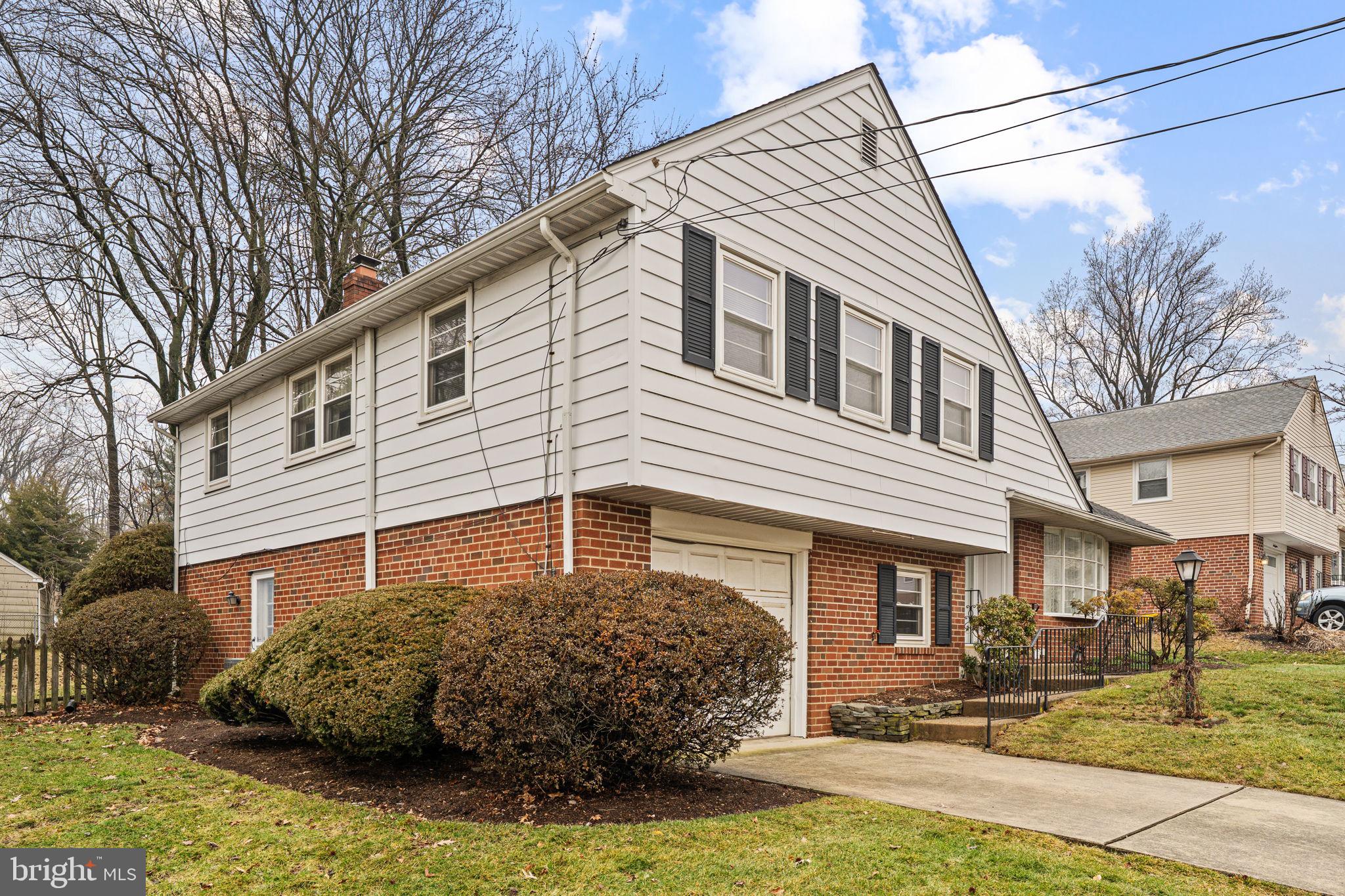 1022 Crozer Lane Springfield, PA 19064 - Photo 38 of 42 a front view of a house with garden