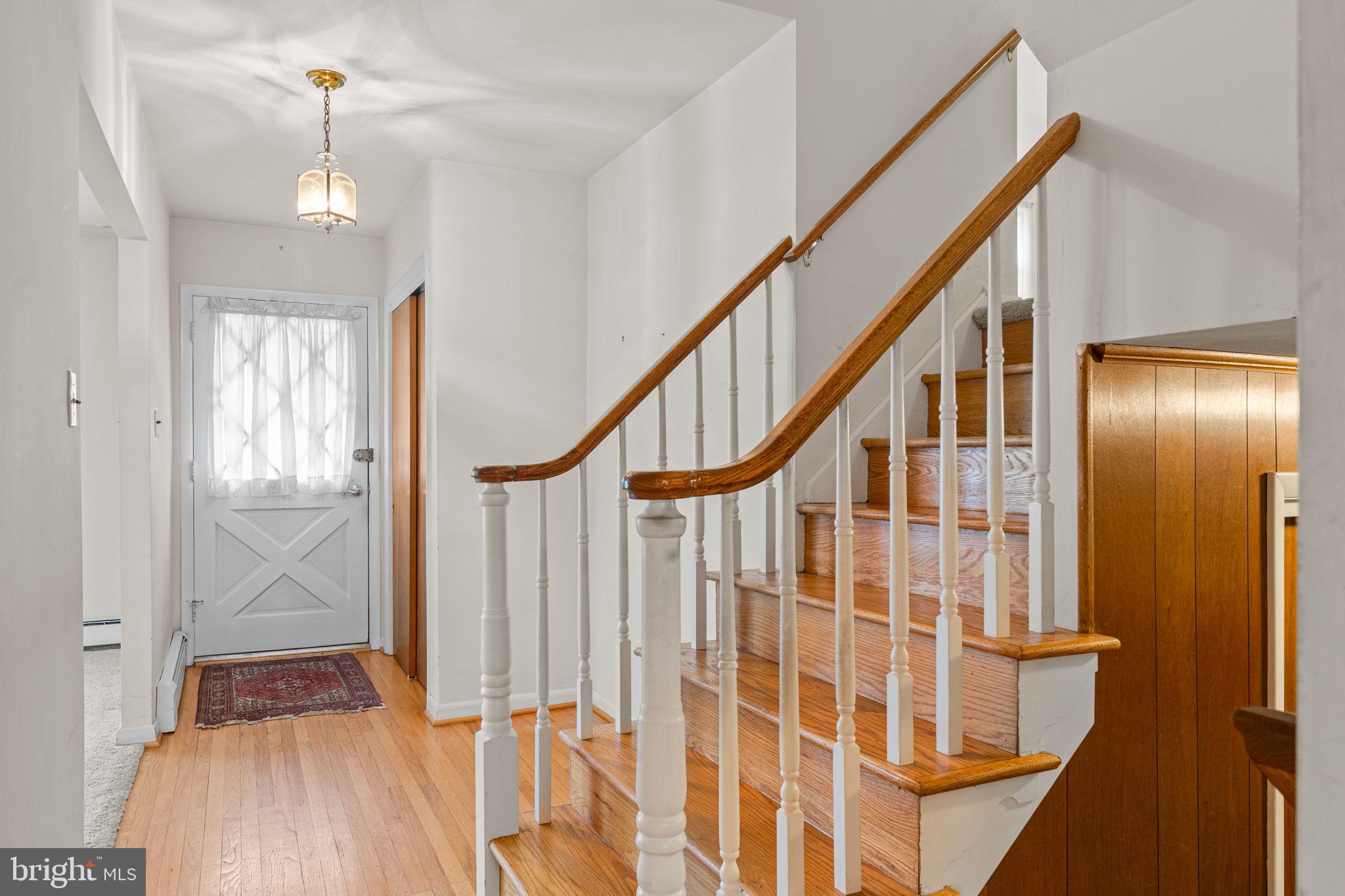 1022 Crozer Lane Springfield, PA 19064 - Photo 4 of 42 a view of entryway with wooden floor and stairs