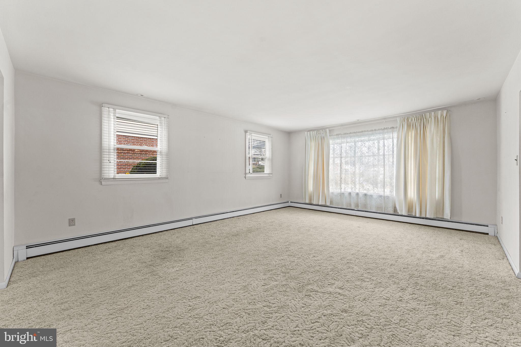 1022 Crozer Lane Springfield, PA 19064 - Photo 5 of 42 an empty room with windows