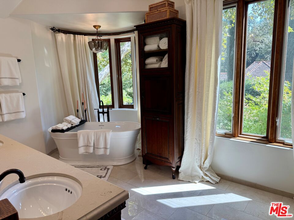 530 Hawthorn Road Sacramento, CA 95864 - Photo 14 of 23 a bathroom with a sink a mirror and next to a window