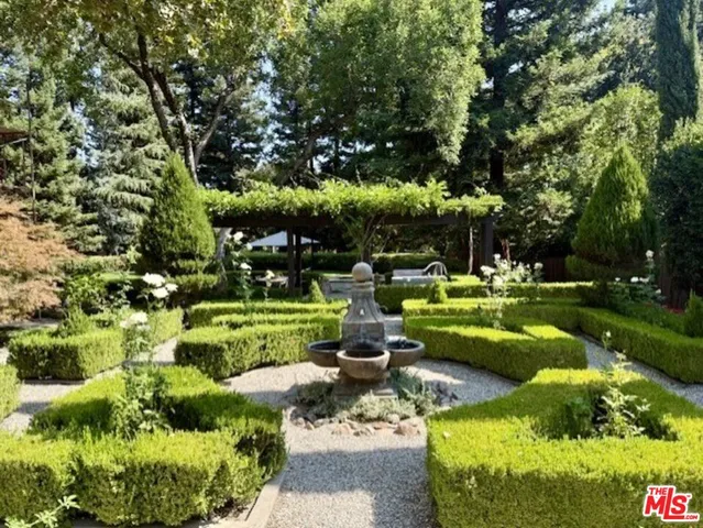 a view of a park with large trees