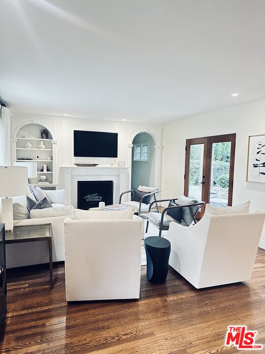 530 Hawthorn Road Sacramento, CA 95864 - Photo 4 of 23 a living room with furniture a fireplace and a flat screen tv