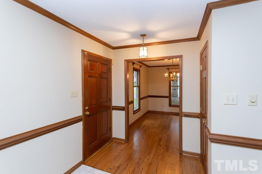 6917 Sandringham Drive Raleigh, NC 27613 - Photo 1 of 25 Gorgeous Refinished hardwood floors with coat closet! Check out all the beautiful moldings and chair railing. New paint and carpet throughout!