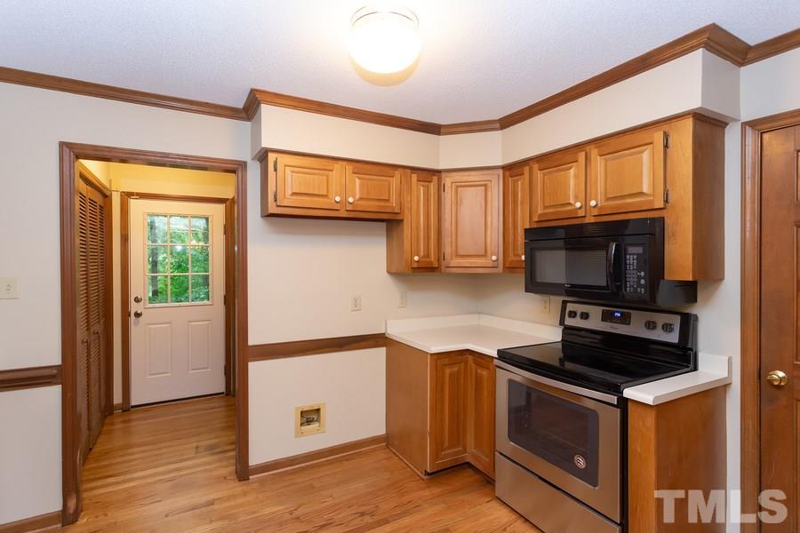 6917 Sandringham Drive Raleigh, NC 27613 - Photo 5 of 25 New stove which has never been used!s Gorgeous hardwood floors which has just been refinished! Who does not love a Lazy Susan!