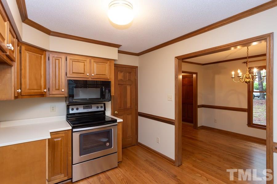 6917 Sandringham Drive Raleigh, NC 27613 - Photo 6 of 25 Do not miss the huge pantry! Many multiple shelving for all your groceries and more!