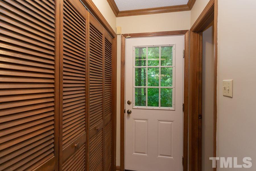 6917 Sandringham Drive Raleigh, NC 27613 - Photo 8 of 25 Washer & Dryer area with access to deck!