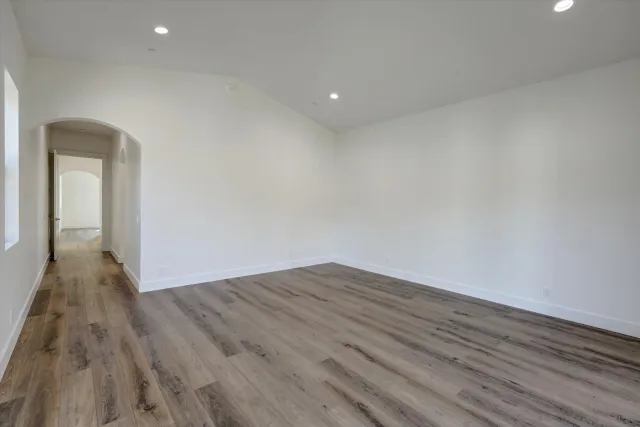a view of a room with wooden floor and a wooden floor