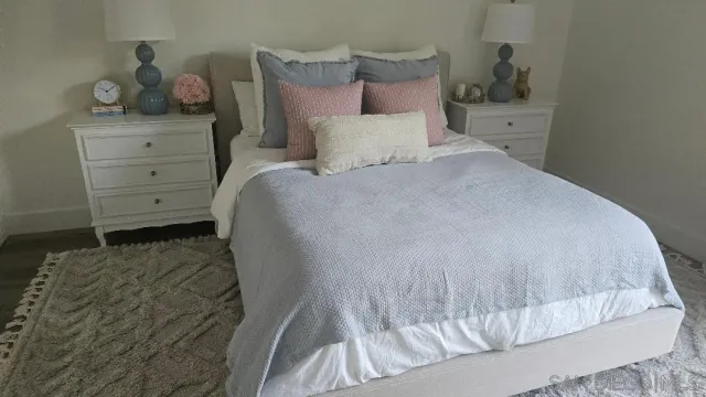 a bedroom with a bed and a cabinets