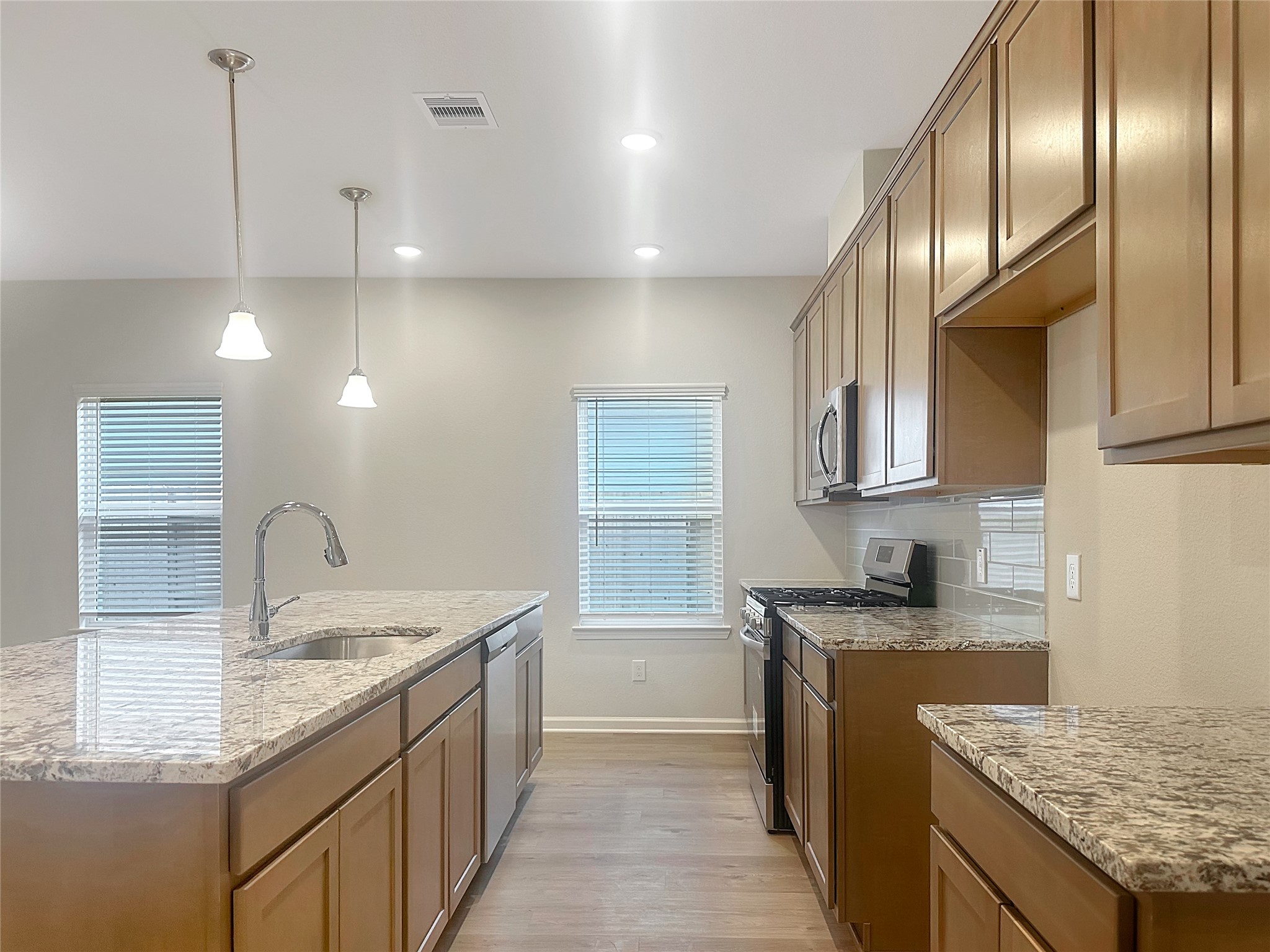 32515 Vly Redstem Way Fulshear, TX 77441 - Photo 7 of 19 The Crawford- Kitchen. Home is under construction, photos used for illustration only; actual features, colors, and upgrades may vary.