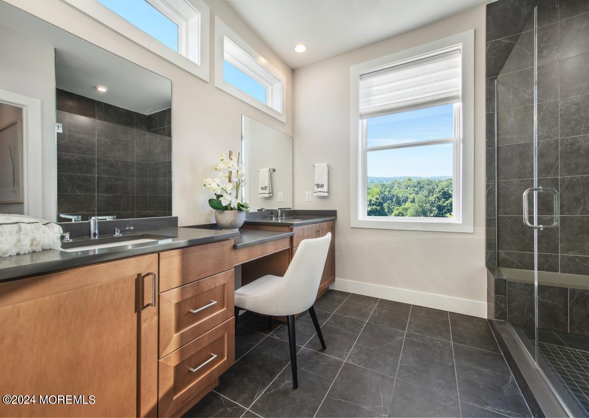 10 Waller Drive Middletown, NJ 07748 - Photo 7 of 25 a large bathroom with a sink and a large mirror