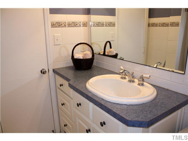 1651 Sutton Drive Raleigh, NC 27605 - Photo 14 of 25 There is an updated vanity in the upstairs bath room. You will appreciate all the storage that it provides. The sink and faucet have been updated as well.