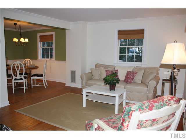 1651 Sutton Drive Raleigh, NC 27605 - Photo 4 of 25 The living room is open to the dining room.