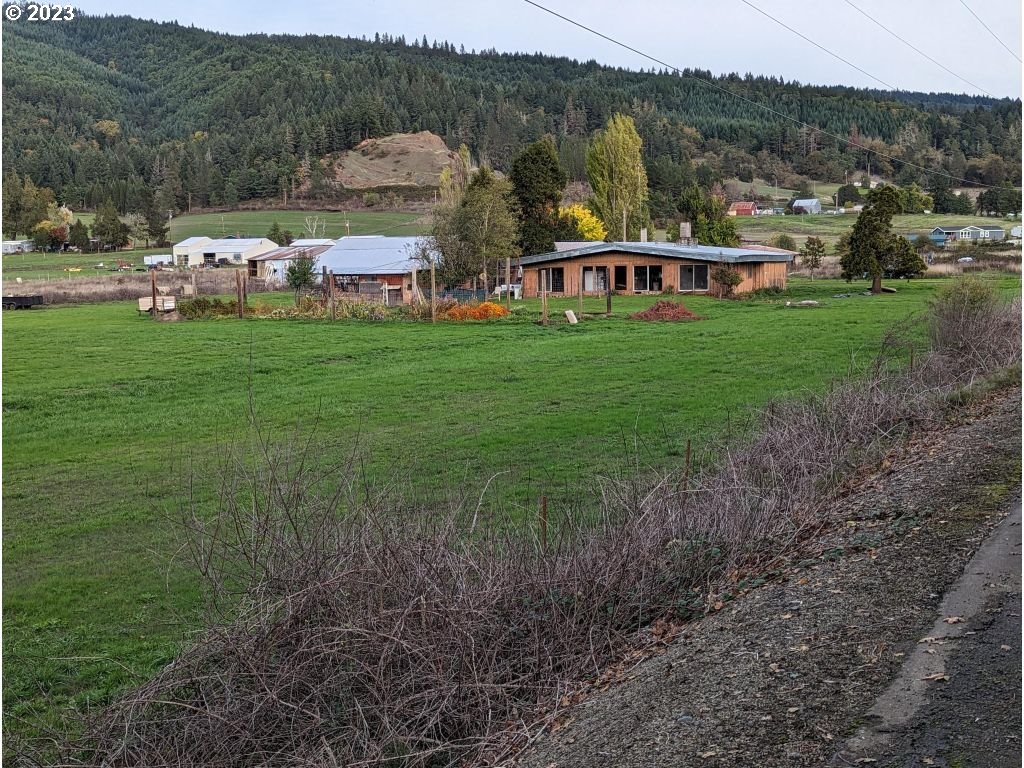 350 Deady Crossing Road Sutherlin, OR 97479 - Photo 1 of 47 a view of a house with a big yard