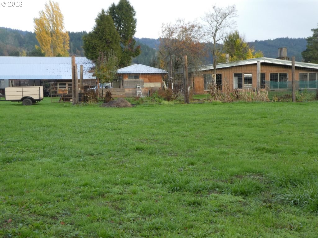 350 Deady Crossing Road Sutherlin, OR 97479 - Photo 13 of 47 a view of a house with a backyard