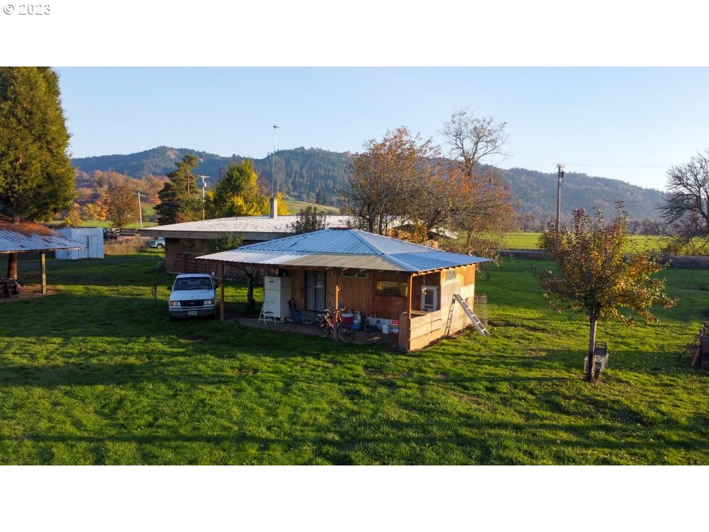 350 Deady Crossing Road Sutherlin, OR 97479 - Photo 14 of 47 a view of a house with a garden