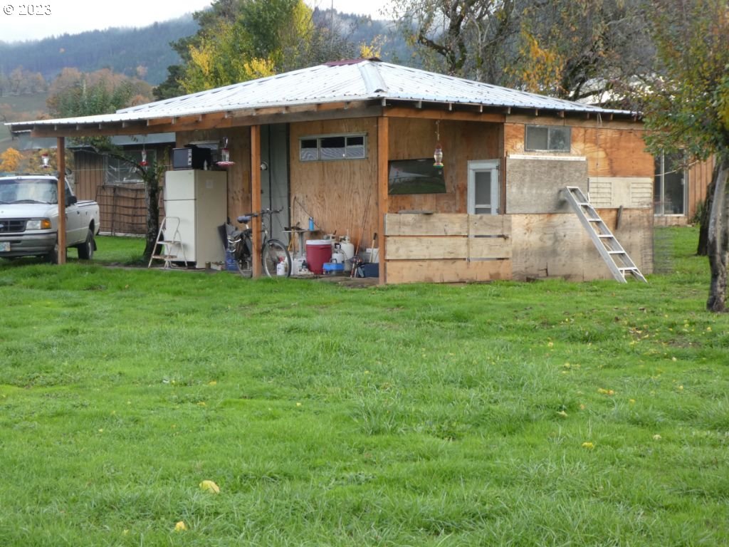 350 Deady Crossing Road Sutherlin, OR 97479 - Photo 15 of 47 a view of a house with backyard