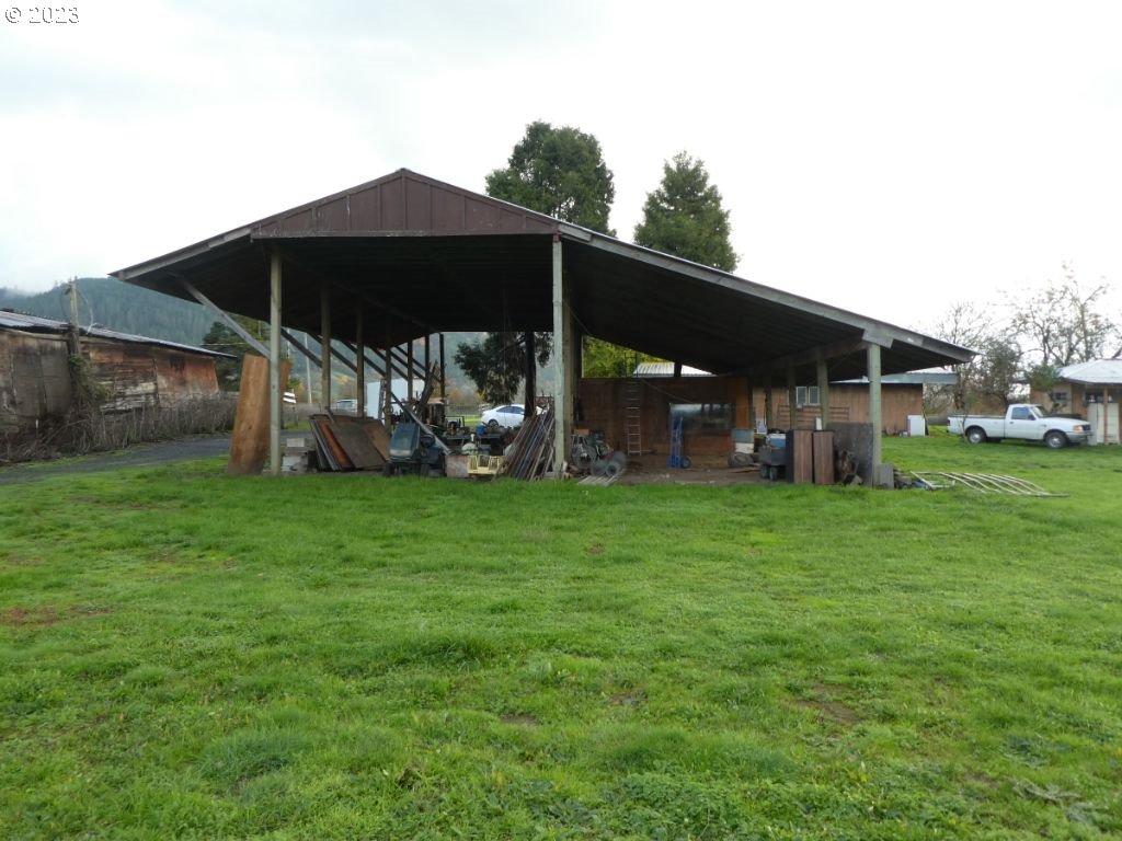 350 Deady Crossing Road Sutherlin, OR 97479 - Photo 16 of 47 a view of a wooden deck in front of house