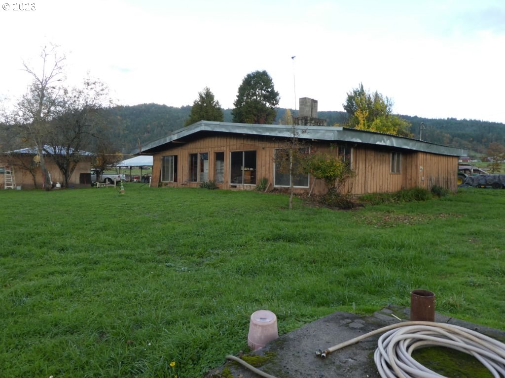 350 Deady Crossing Road Sutherlin, OR 97479 - Photo 21 of 47 a front view of a house with garden