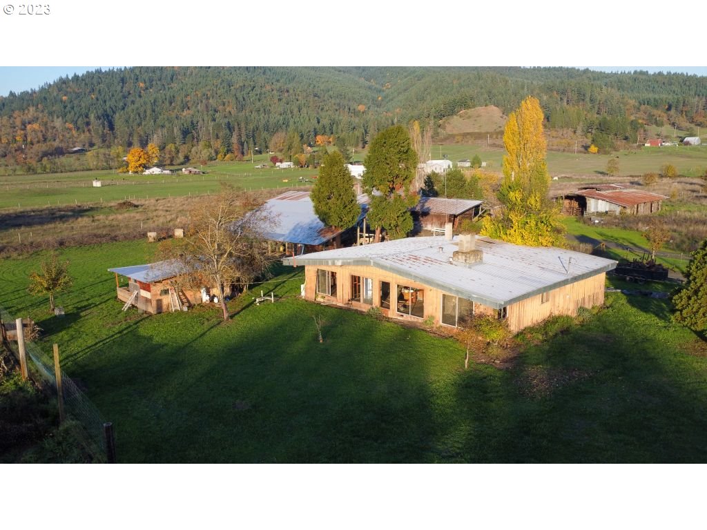350 Deady Crossing Road Sutherlin, OR 97479 - Photo 4 of 47 a picture of houses with outdoor space and view of lake