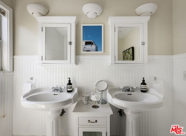 a view of backyard with outdoor seating and trees