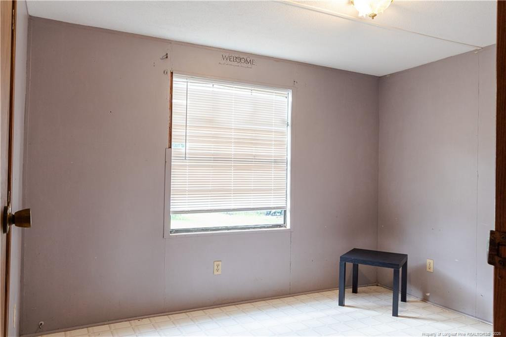 231 Knight Lane Autryville, NC 28318 - Photo 26 of 27 a view of an empty room and a window