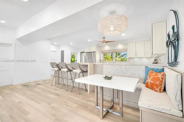 a spacious bedroom with a bed and a chair