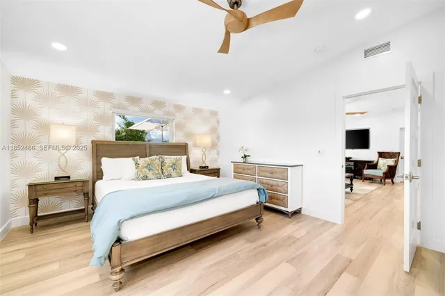 a bathroom with a double vanity sink mirror and shower