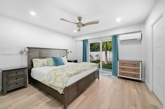 a bathroom with a granite countertop sink mirror and shower