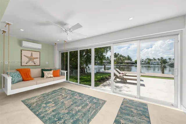 a view of a house with garden and sitting area